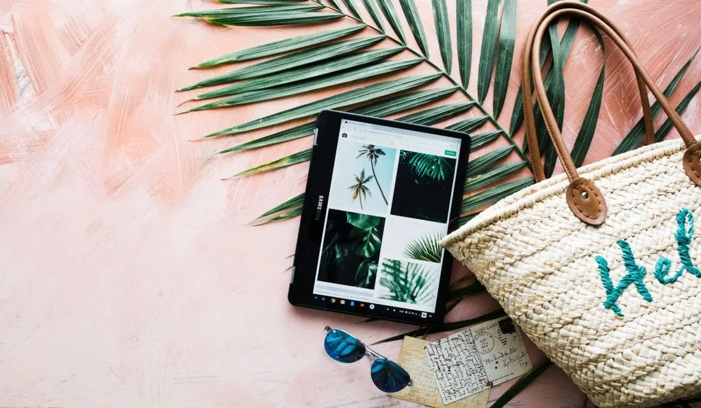 tablet, pink background, summer beach bag, palm leaf, sunglasses Everything Abode.com 