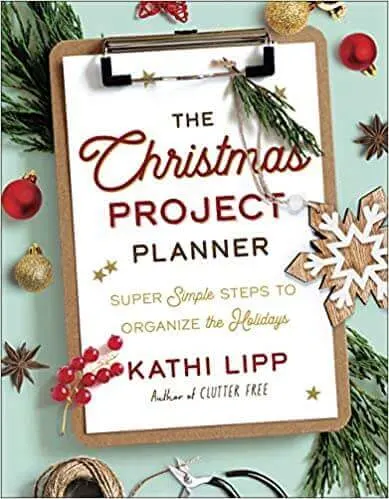 Write down a detailed list in a Christmas planner.