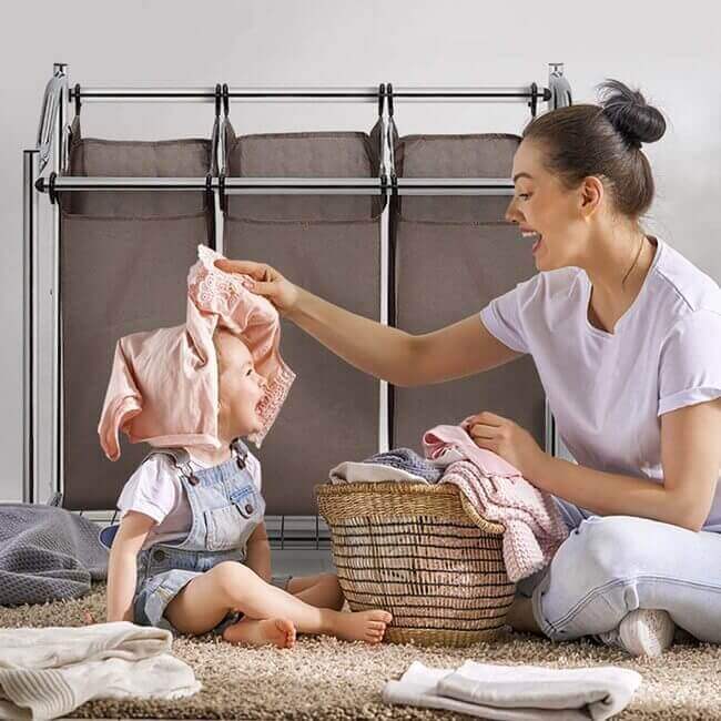 separate clothes by color using a laundry hamper to organize the laundry room