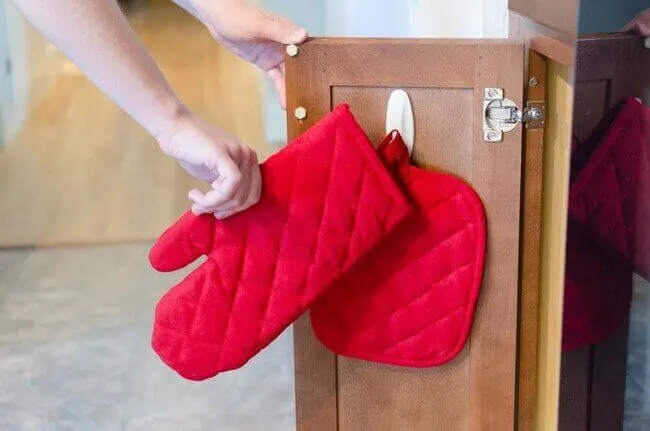 Hang your mitts and most used towels - kitchen organizing made easier - Everything Abode