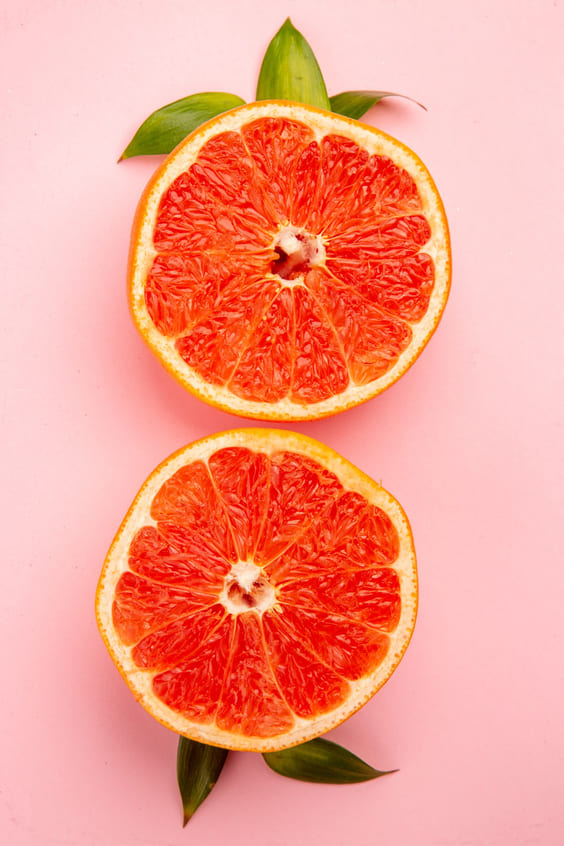 pink grapefruit with pink background