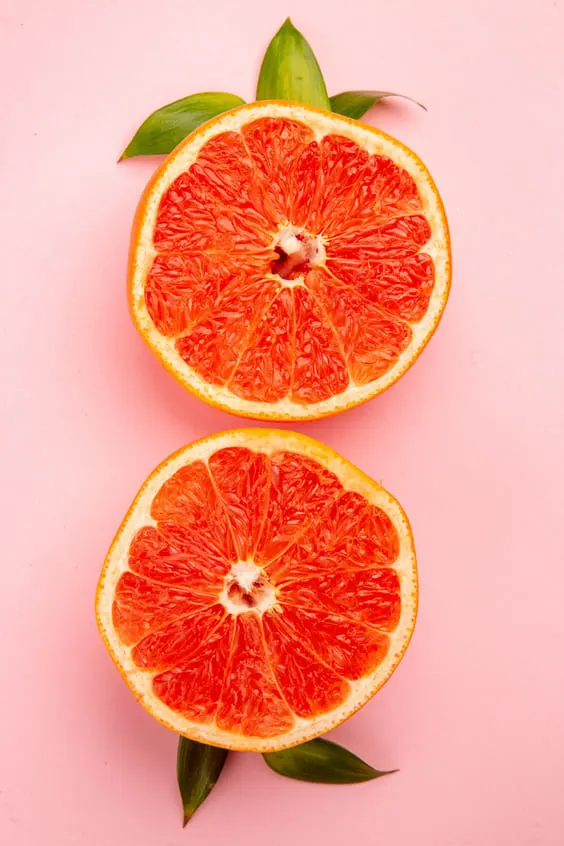 pink grapefruit with pink background