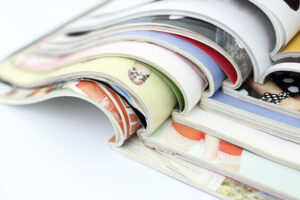 stack of magazines on table to inspire a vision board