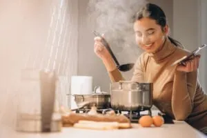 woman cooking in kitchen for fun hobby