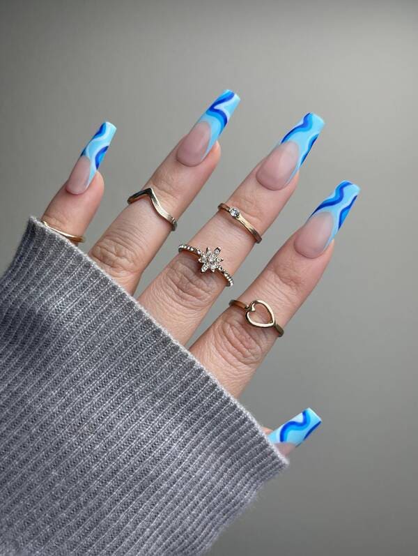 Aqua blue french tip nails with swirls