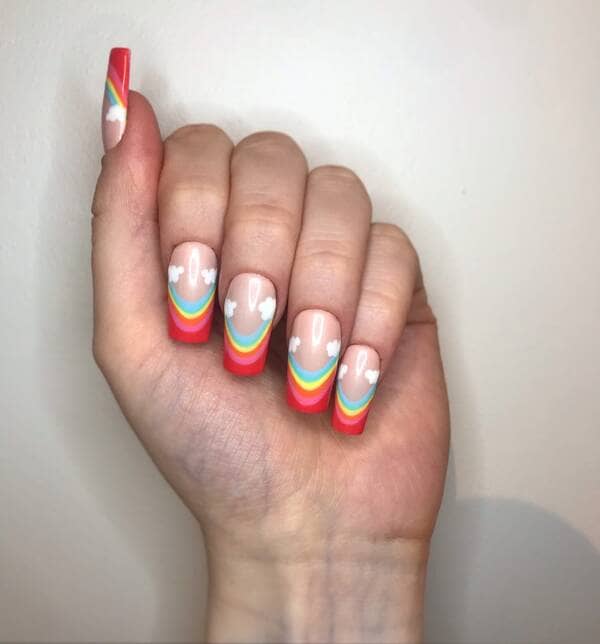 Rainbows and clouds french manicure nails