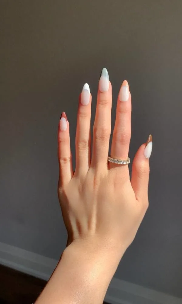 Nude mixed coloured french tip nails