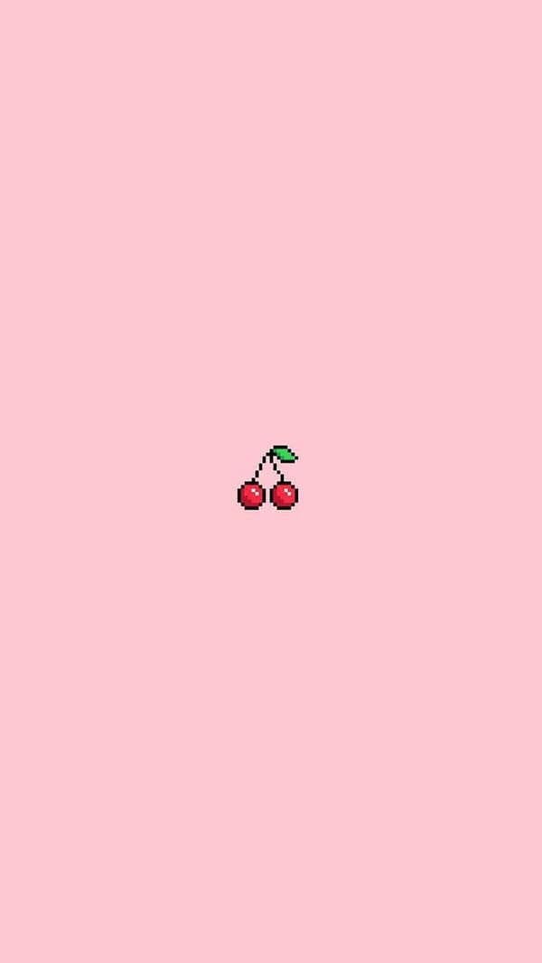 pixilated red cherries in the middle with a soft pastel pink background