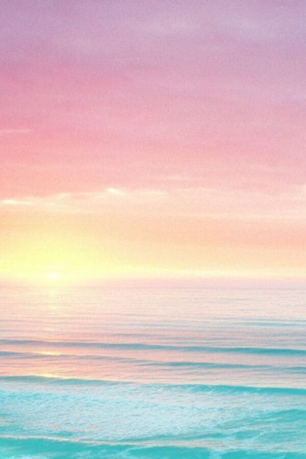 blue pastel sea with yellow and pink sunset