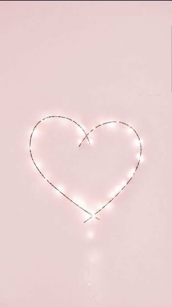 Pink pastel glowing heart mobile background