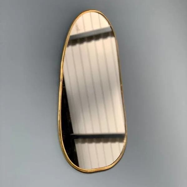 Golden brass oval mirror.