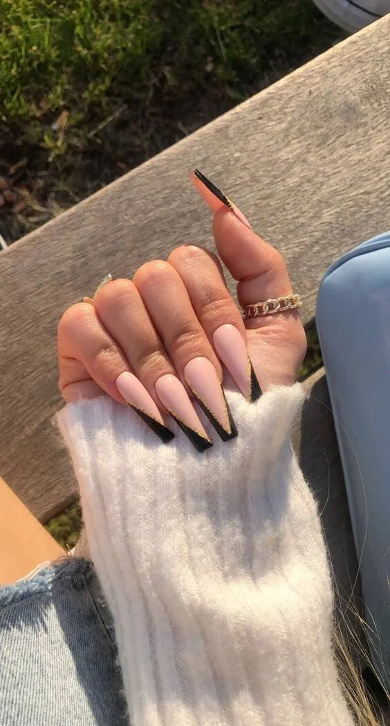 Pink nails with black details and gold
