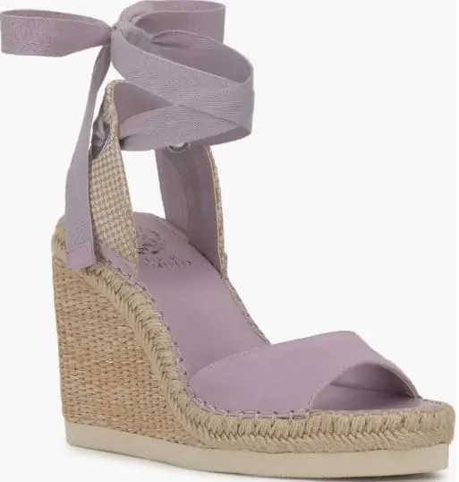 Soft lavender espadrille wedges with elegant ribbon lace-up ties and a woven platform