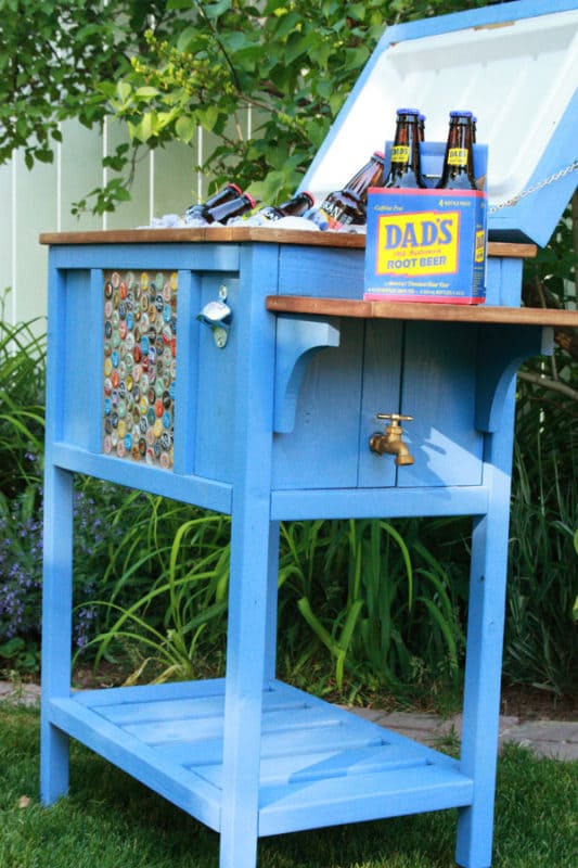 upcycled wood furniture painted blue and turned into a outdoor bar cart