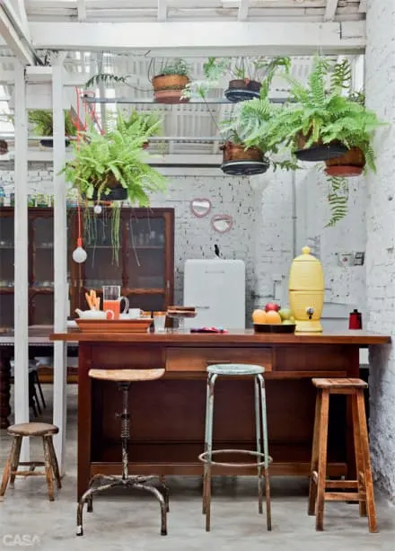 outdoor kitchen made to look like an outdoor tropical oasis