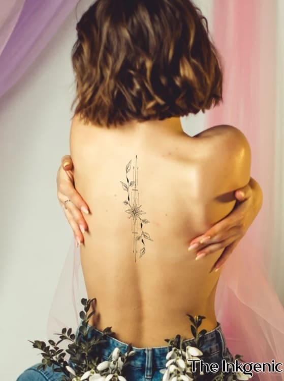 Fine line ornament tattoo located on the upper back