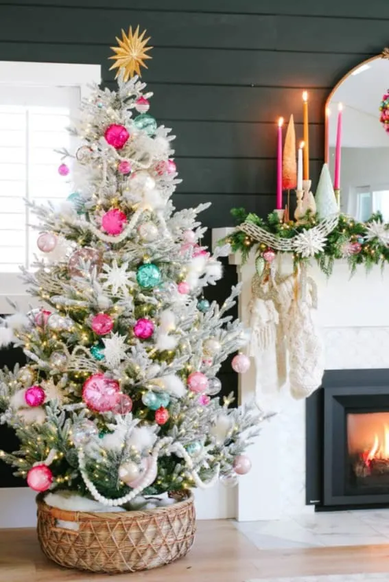 Snowflake-adorned Christmas tree with colorful accents.