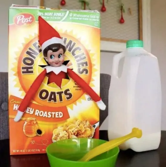 Elf on the Shelf emerges from Honey Bunches of Oats cereal box.