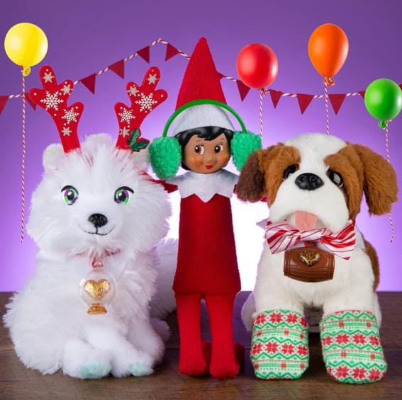 Elf on the Shelf celebrating with plush toy friends.