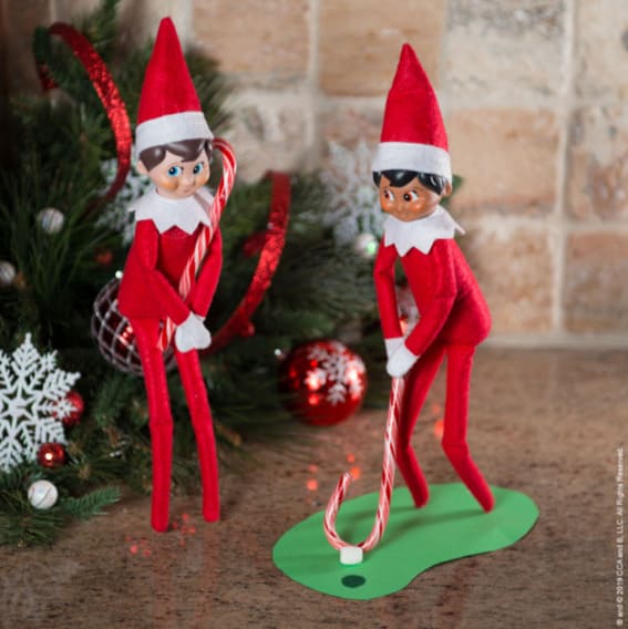 Elves on the Shelf play a charming game of candy cane mini-golf.
