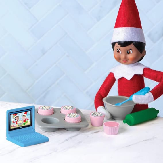 Elf on the Shelf baking cupcakes.