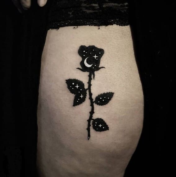 black rose tattoo with stars and moon