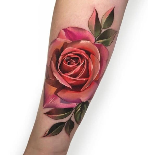 pretty pink and red rose tattoo on womans inner arm large