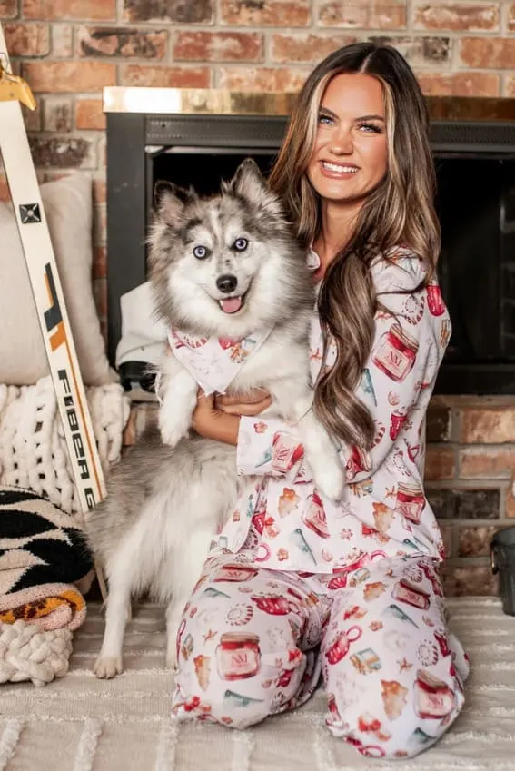 Woman in Festive Christmas Pajamas Adorned with Seasonal Decor