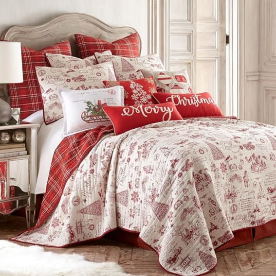 A cozy Christmas bedding set with a vibrant red theme.