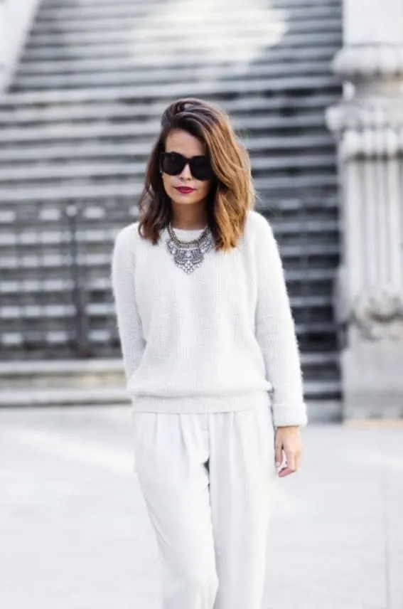 Chic all-white holiday outfit with statement necklace, featured by Style Motivation