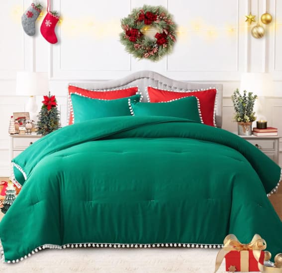 King-size green Christmas comforter set with pom pom fringe.