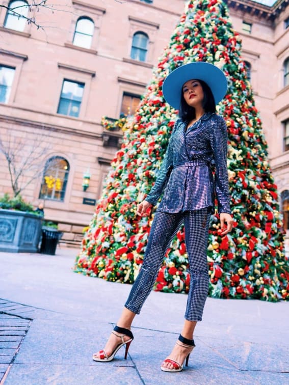 Striking sequin suit and blue hat ensemble, 