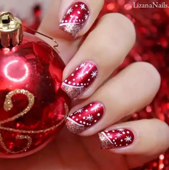 Short nails with red and glitter design and delicate snowflakes