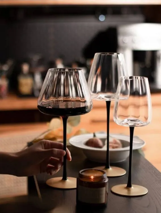 Elegant stemware with black stems and clear bowls.