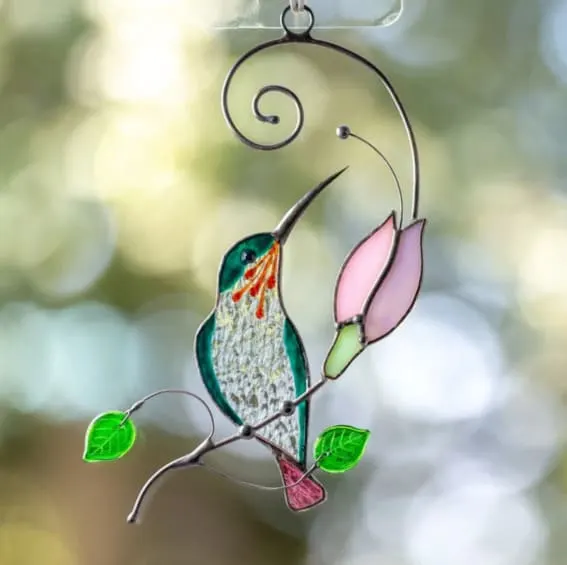 Handcrafted stained glass hummingbird suncatcher, a sparkling Christmas adornment.