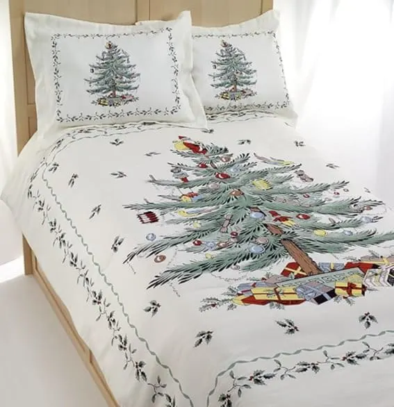 A queen bedding set featuring the iconic Spode Christmas tree design with matching shams.