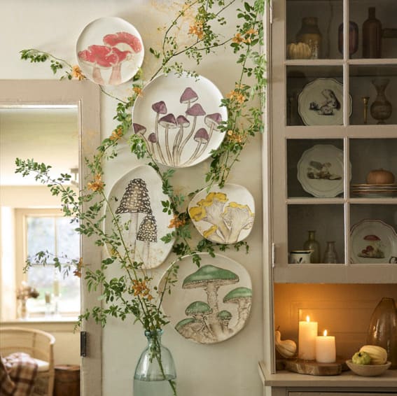 An oval serving platter with a delicate mushroom illustration.