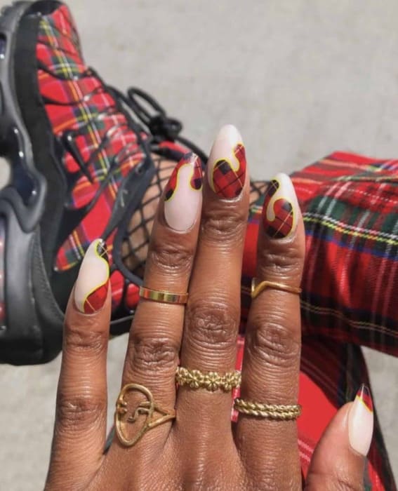 Short nails featuring chic tartan swirl designs