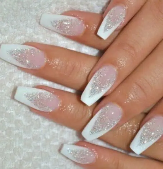 Short nails with white tips and sparkling silver glitter