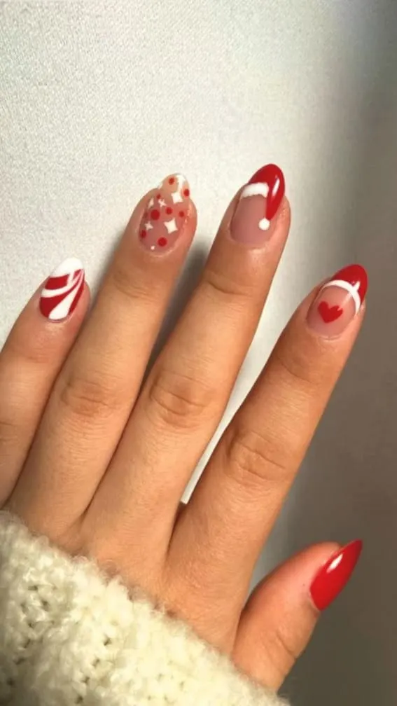 Short nails with a Santa hat design on a French tip