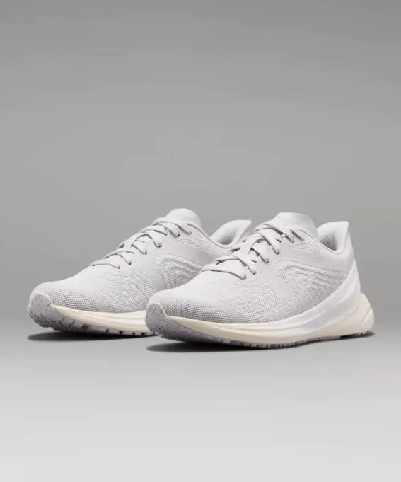 A pair of modern white running shoes.