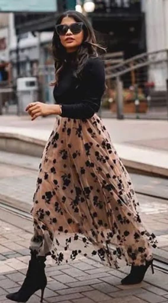 Fashion-forward black top and floral maxi skirt ensemble from Chicwish