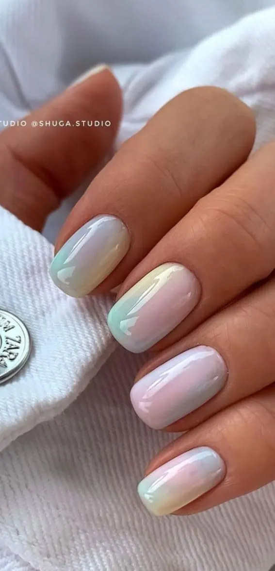 Oval nails featuring a gentle pastel ombre blend.