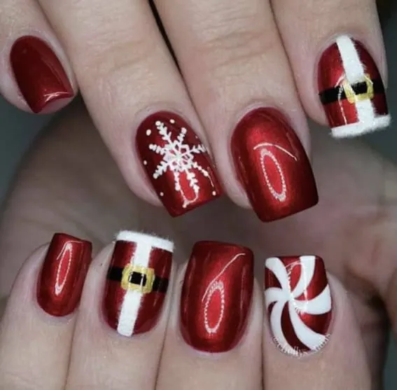 Short nails with Santa belt, snowflake, and candy cane designs