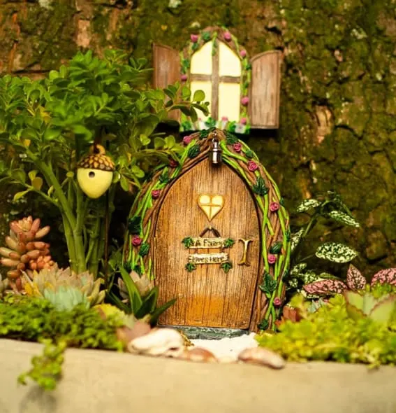 cute little fairy garden door for cottagecore outdoor decor idea