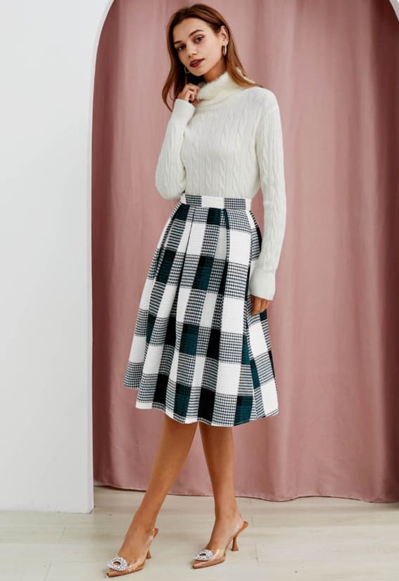 Elegant white cable knit and plaid skirt combo from Chicwish