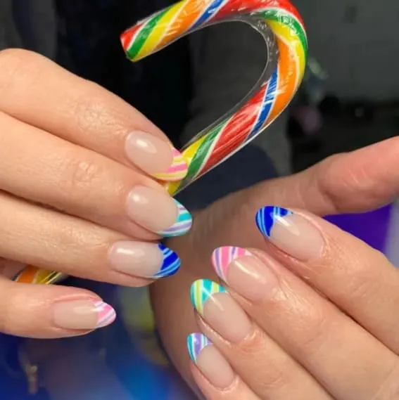 French manicure with colorful candy cane stripe accents.