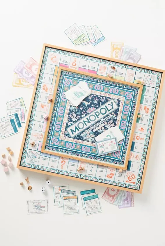 A beautifully designed Monopoly board game spread out on a table.