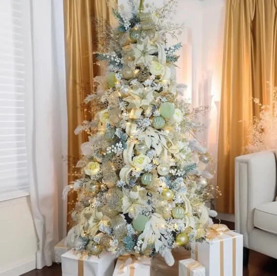 A 5FT WBHome pre-lit artificial Christmas tree with gold and white themed ornaments and 200 plug-in LED lights, elegantly displayed in a classic living room.