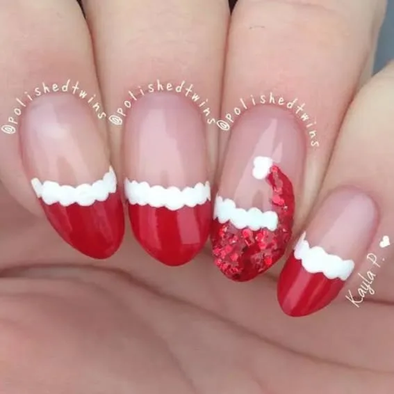 Short nails with glossy red and white trim resembling Santa's suit